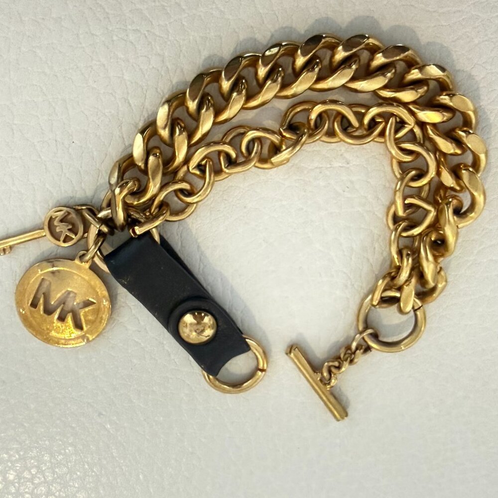 MICHAEL KORS GOLD TONE MULTI STRAND LEATHER & CHAIN CHARM BRACELET